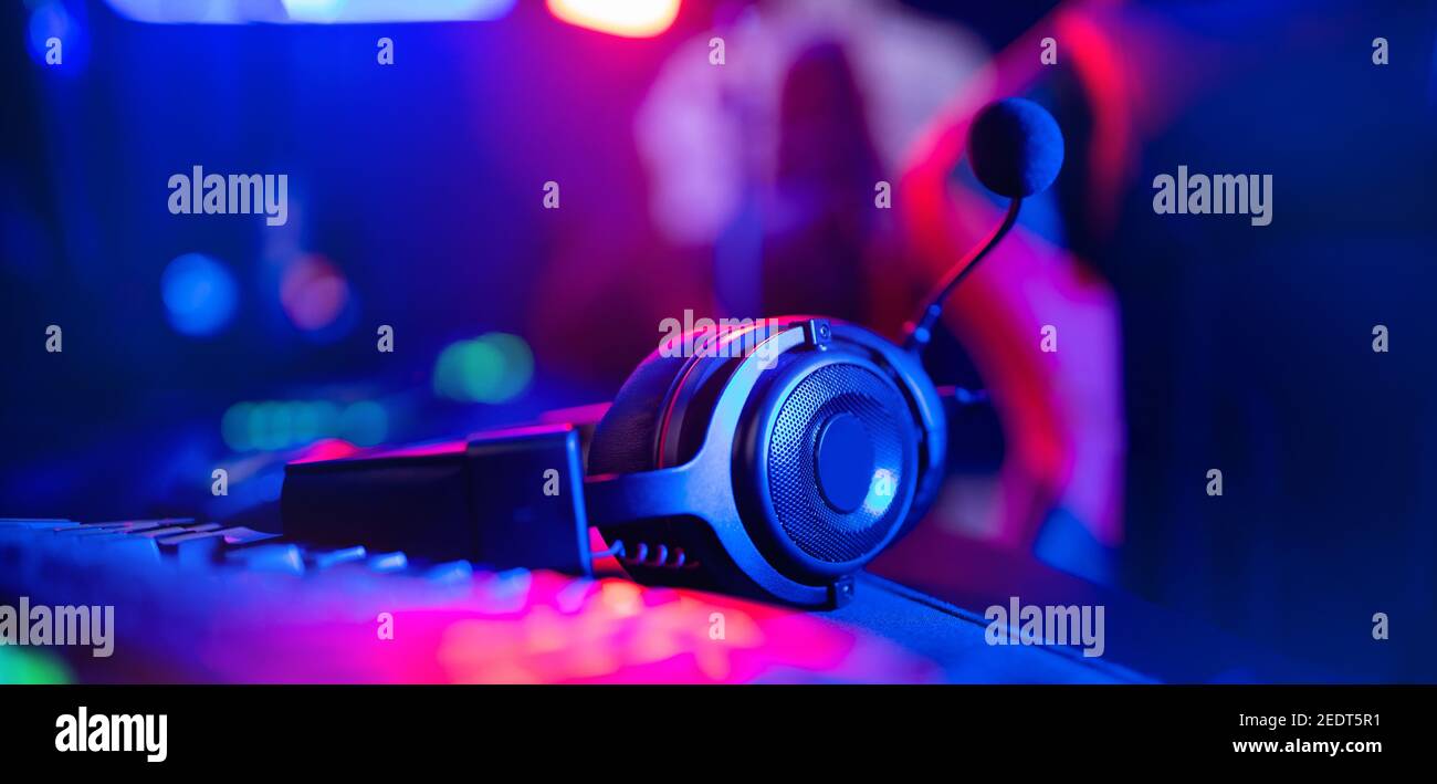 Headphones with microphone for video games and cyber sports on neon