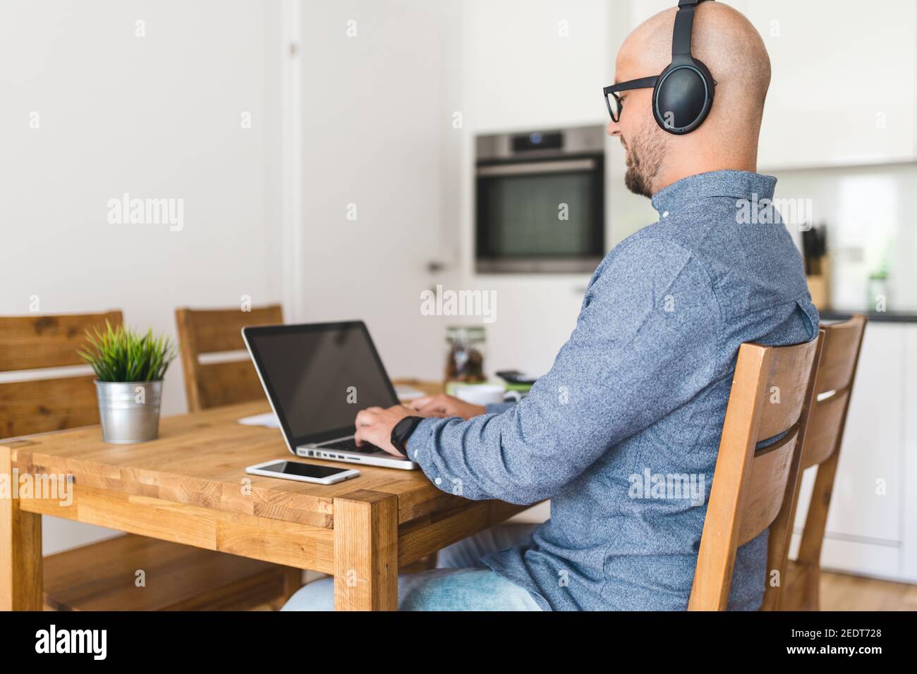 Man working from home during the coronavirus Covid 19 pandemic Stock ...