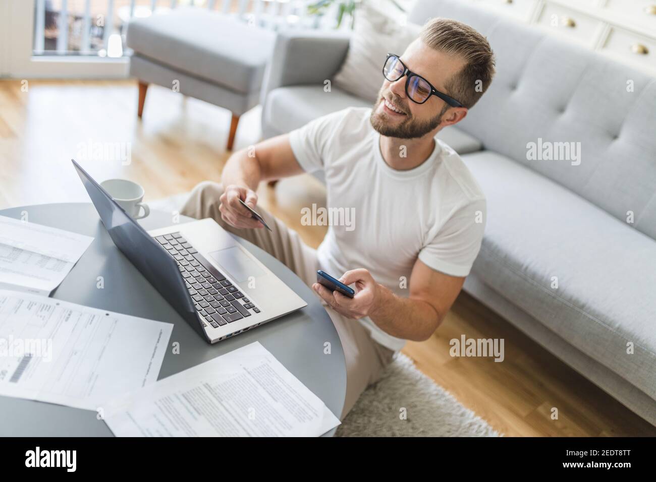 Man working from home during the coronavirus Covid 19 pandemic Stock ...