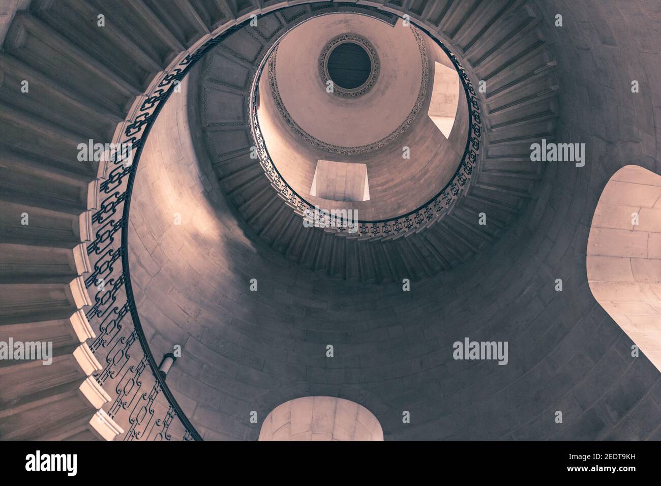 The Dean's Staircase, St Paul's Cathedral, view up spiral stairs made famous as the Divination Stairwell in the Harry Potter films, London UK Stock Photo