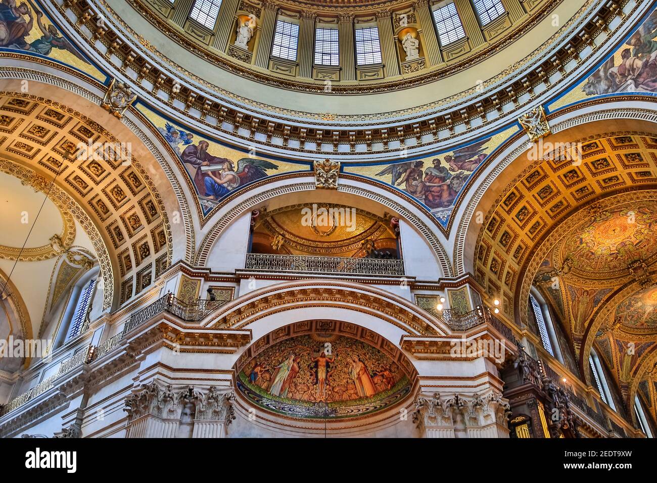 St Paul's Cathedral interior, view up to painted ceiling carvings and gilded decorations of the inner dome, London, England Stock Photo
