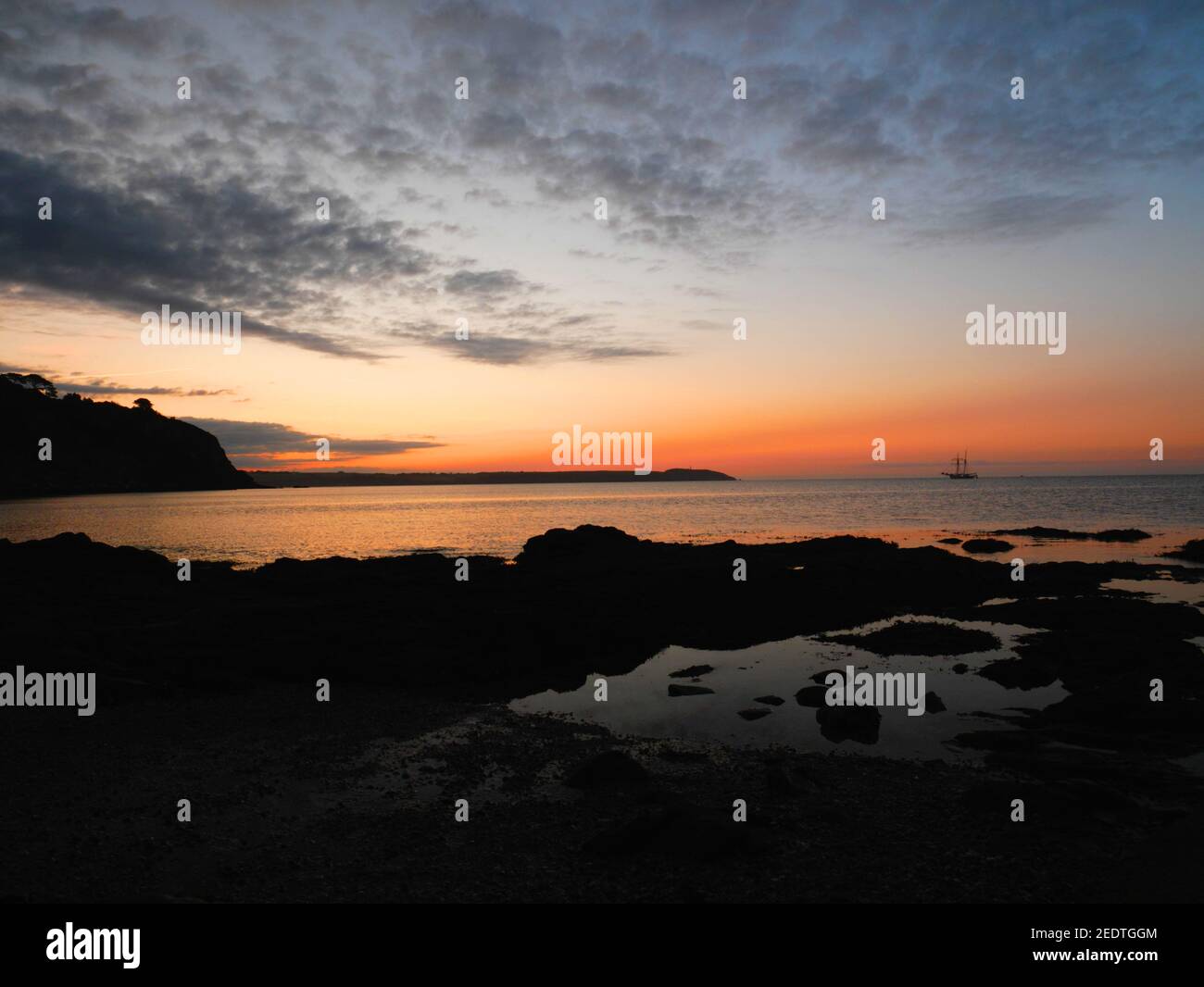 Sunrise over St Austell Bay, seen from Charlestown, Cornwall. Stock Photo