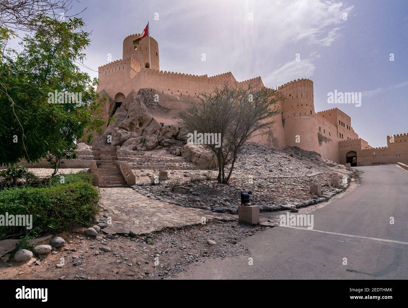 Walls of medieval arabian fortress in Nakhal, Oman. Hot day with haze