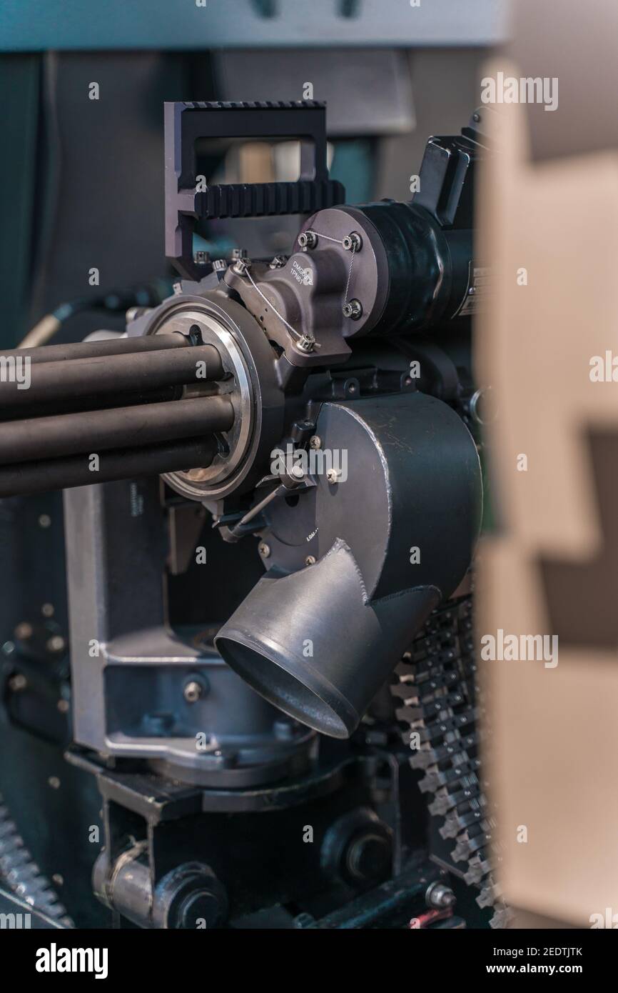 Closeup of a powerful rapid fire heavy machine gun with ammunition Stock Photo