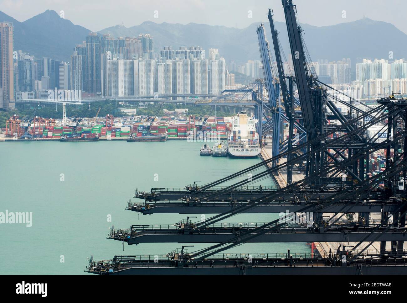 Aerial view of containers stacked at the Container terminal of Kwai Tsing, Kwai Chung, Lai Chi Kok stored until the loading and transfer from ships to trucks in Hong Kong, SAR, China. © Time-Snaps Stock Photo