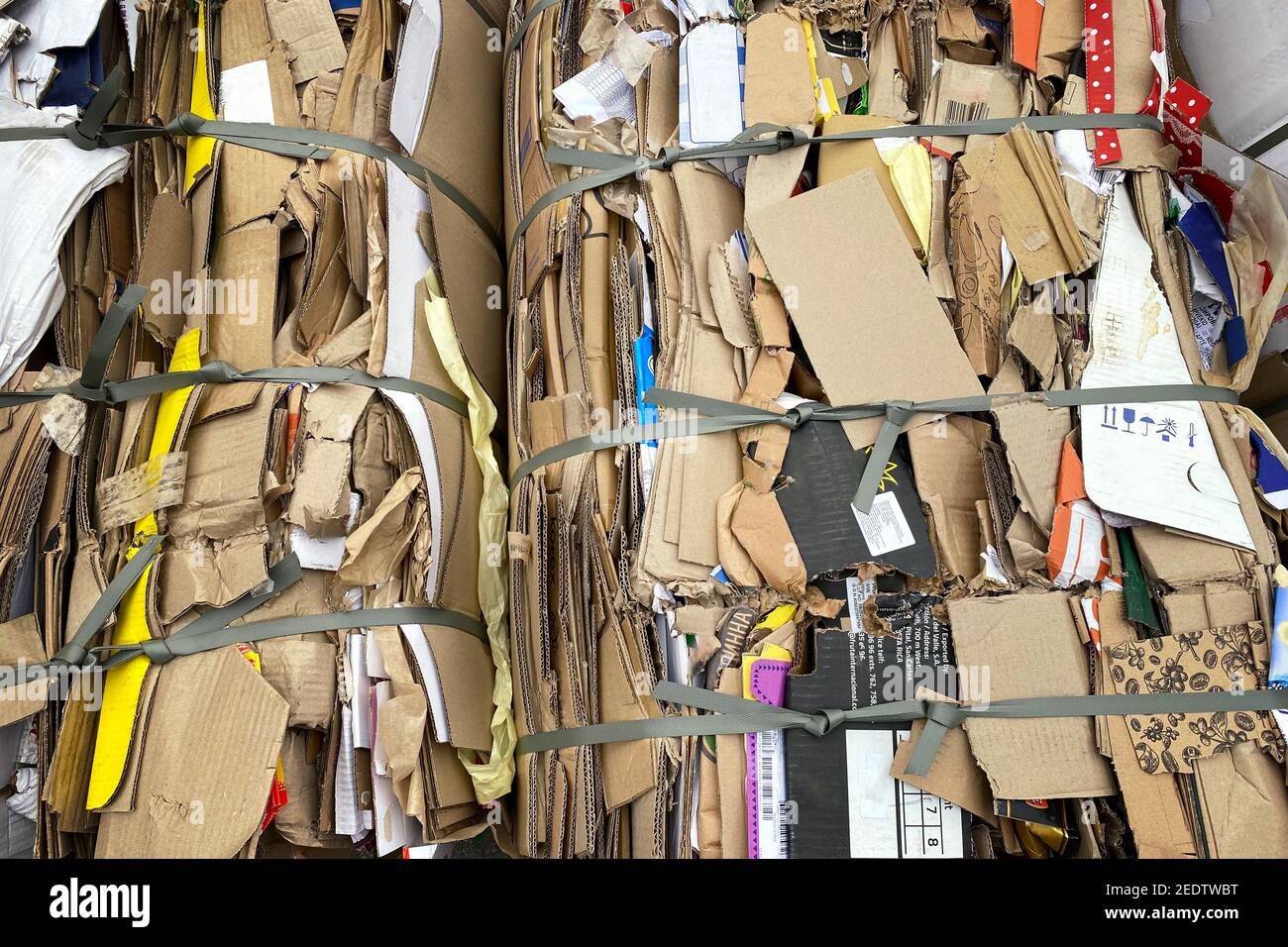Cardboard and stacks of papers ready to be recycled in stock. Urban