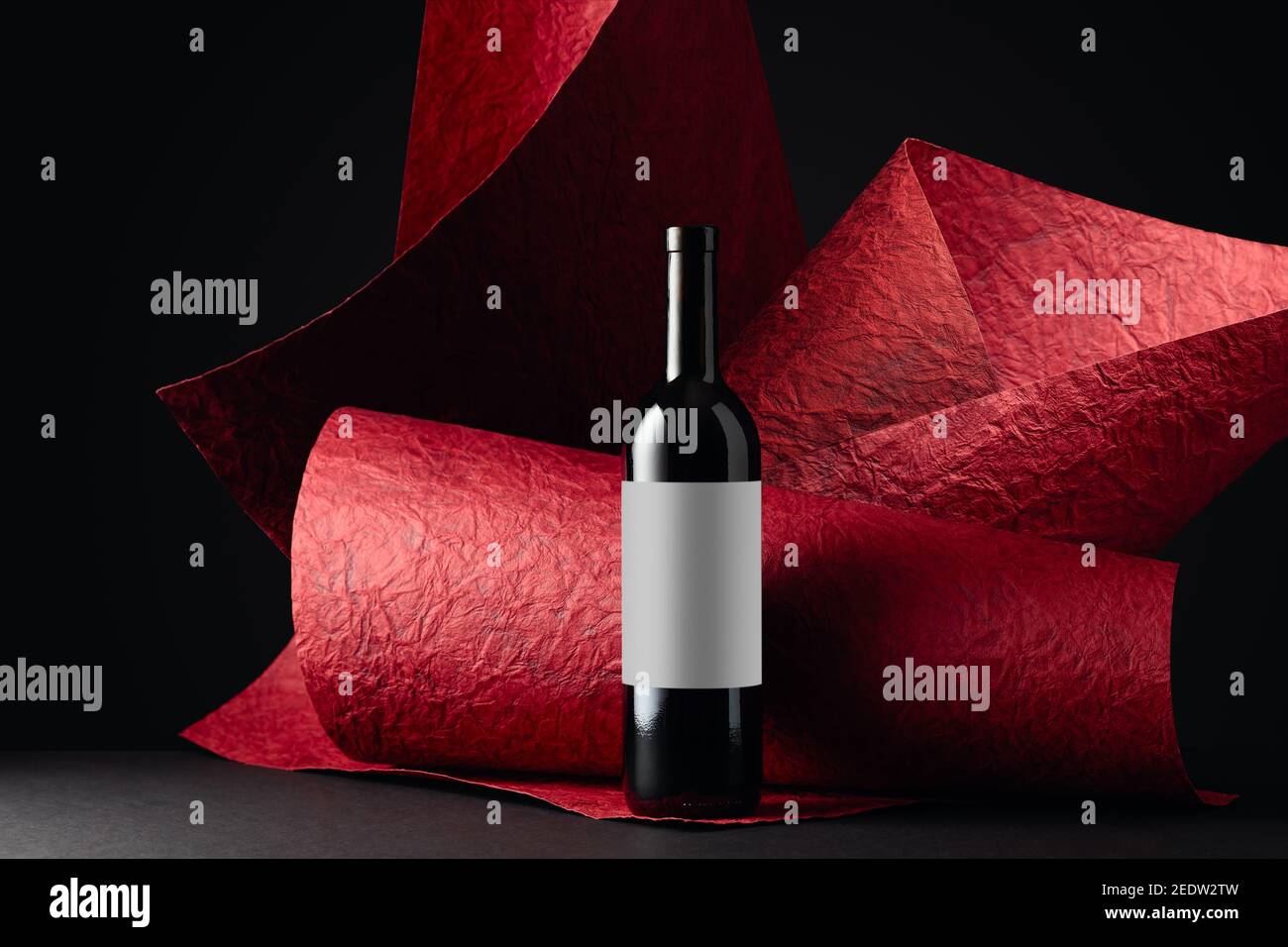 Unopened red wine bottle with empty label. Saved clipping path for the