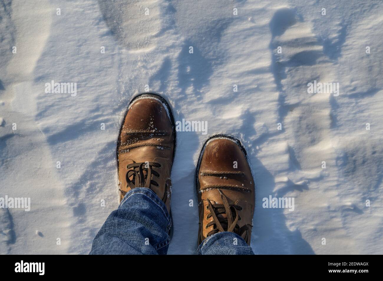 Top view of boots on frozen sea surface. Stock Photo