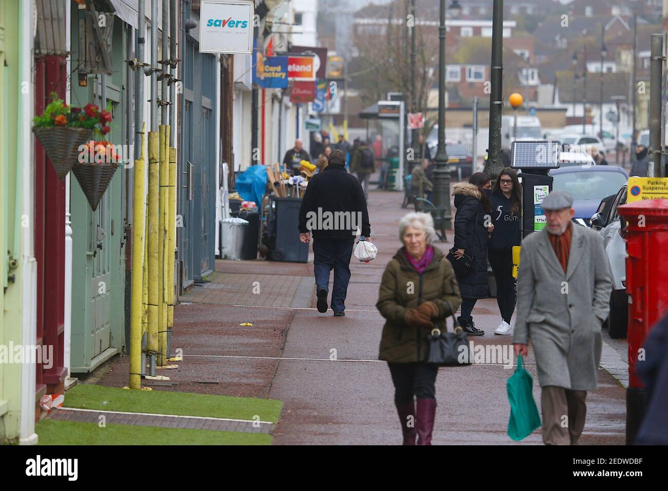 Bexhill-on-Sea, East Sussex, UK. 15 Feb, 2021. UK Weather: A breezy and overcast day in the small seaside town of Bexhill with the weather expected to improve later in the week. A few people out shopping the majority wearing face masks. Photo Credit: Paul Lawrenson/Alamy Live News Stock Photo