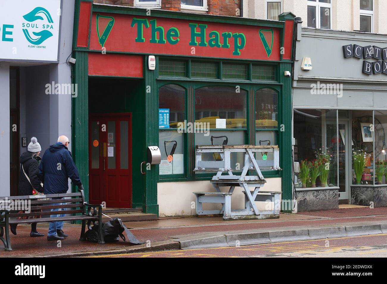 Bexhill-on-Sea, East Sussex, UK. 15 Feb, 2021. UK Weather: A breezy and overcast day in the small seaside town of Bexhill with the weather expected to improve later in the week. Closed down The Harp pub. Photo Credit: Paul Lawrenson/Alamy Live News Stock Photo