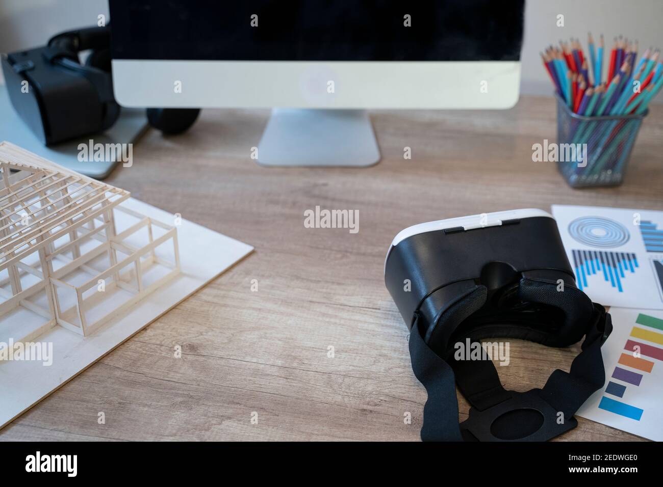 VR glasses and architectural model on desk. Stock Photo