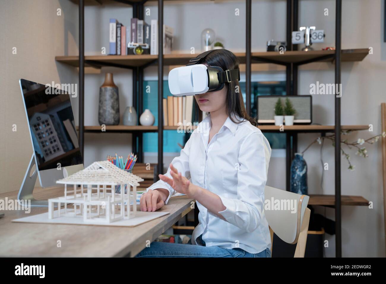 Women with architectural model and VR glasses. Stock Photo