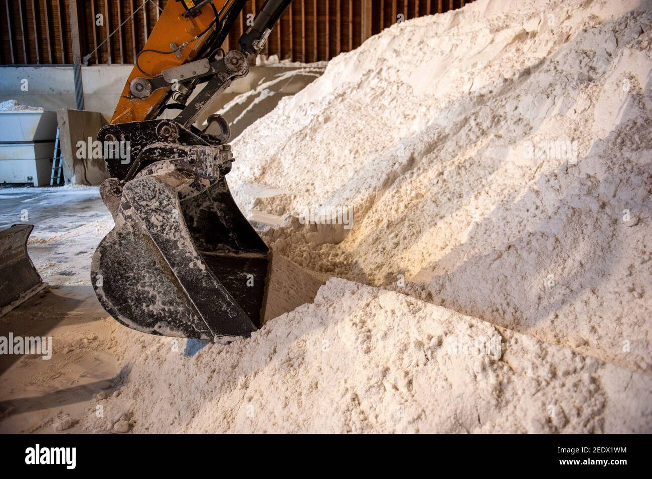 Salt in a salt storage used for anti skidding on a road. Stock Photo