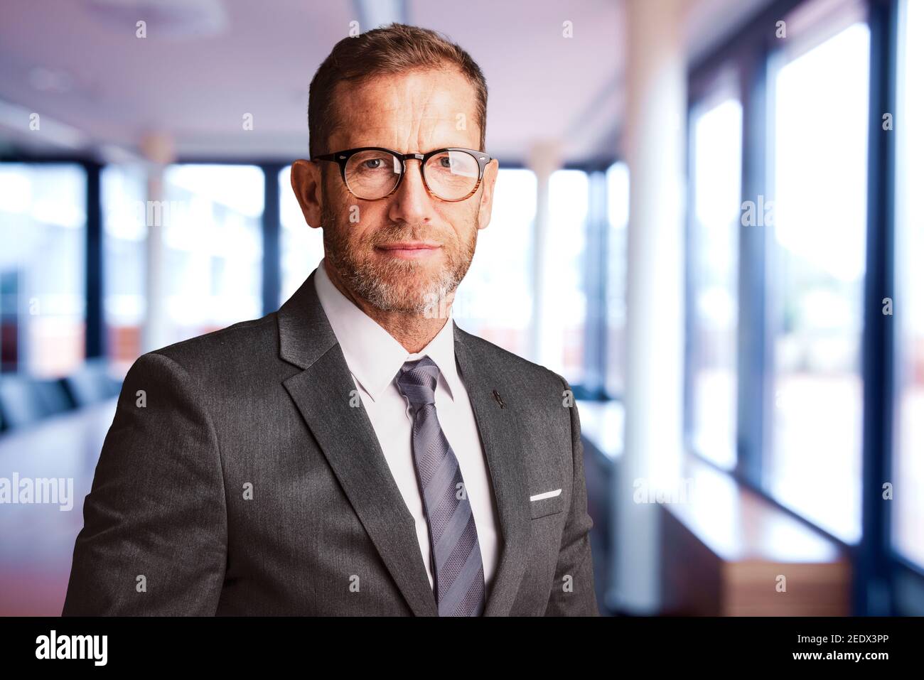 Close-up of executive businessman wearing suit and tie while standing ...