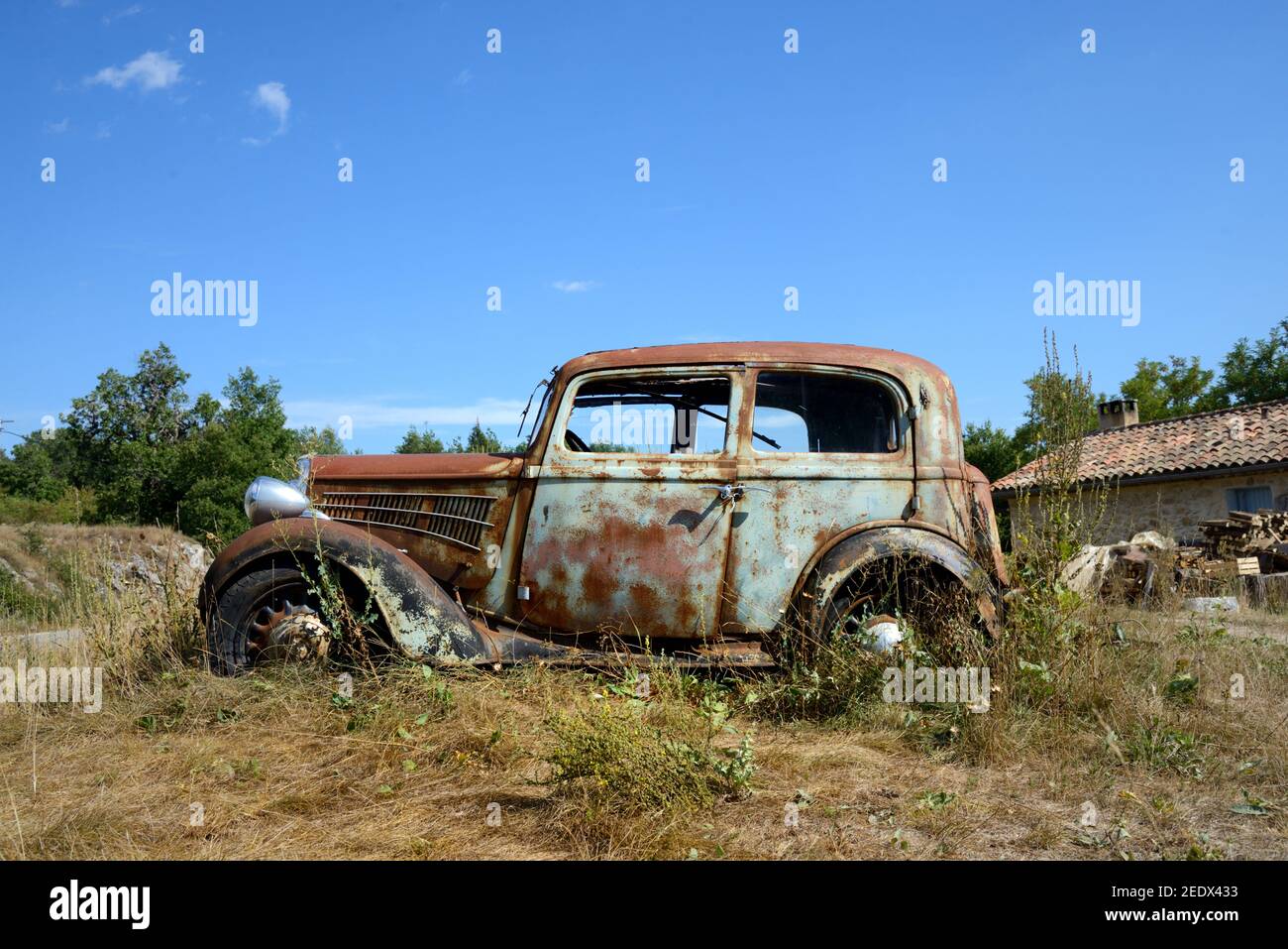 Rusty Old Vintage Peugeot 201 Car or Car Wreck from the 1930s on the Roadside near Trigance Var Provence France Stock Photo