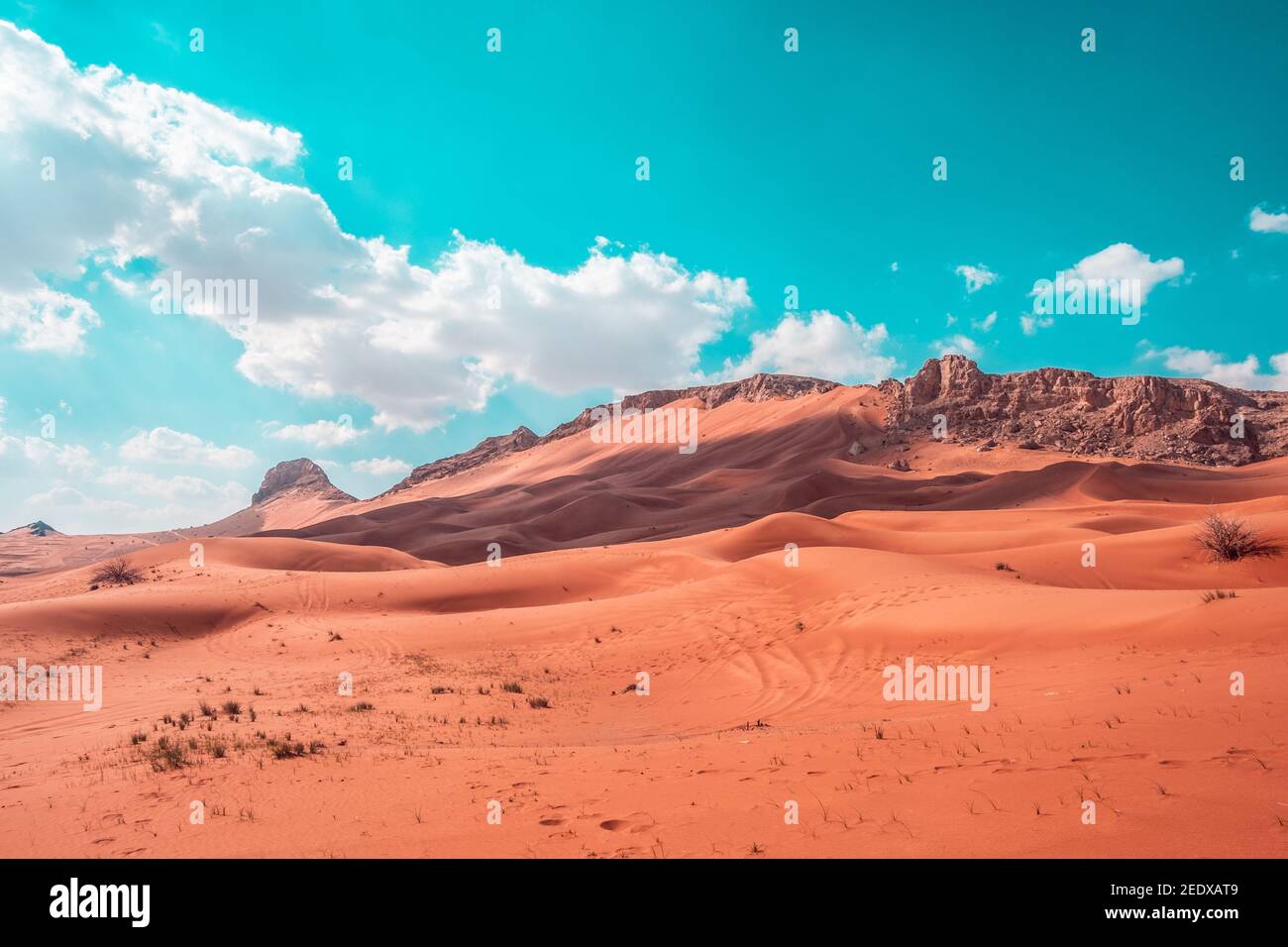 Beautiful shot of sand dunes under a bright sky on the desert in Dubai ...