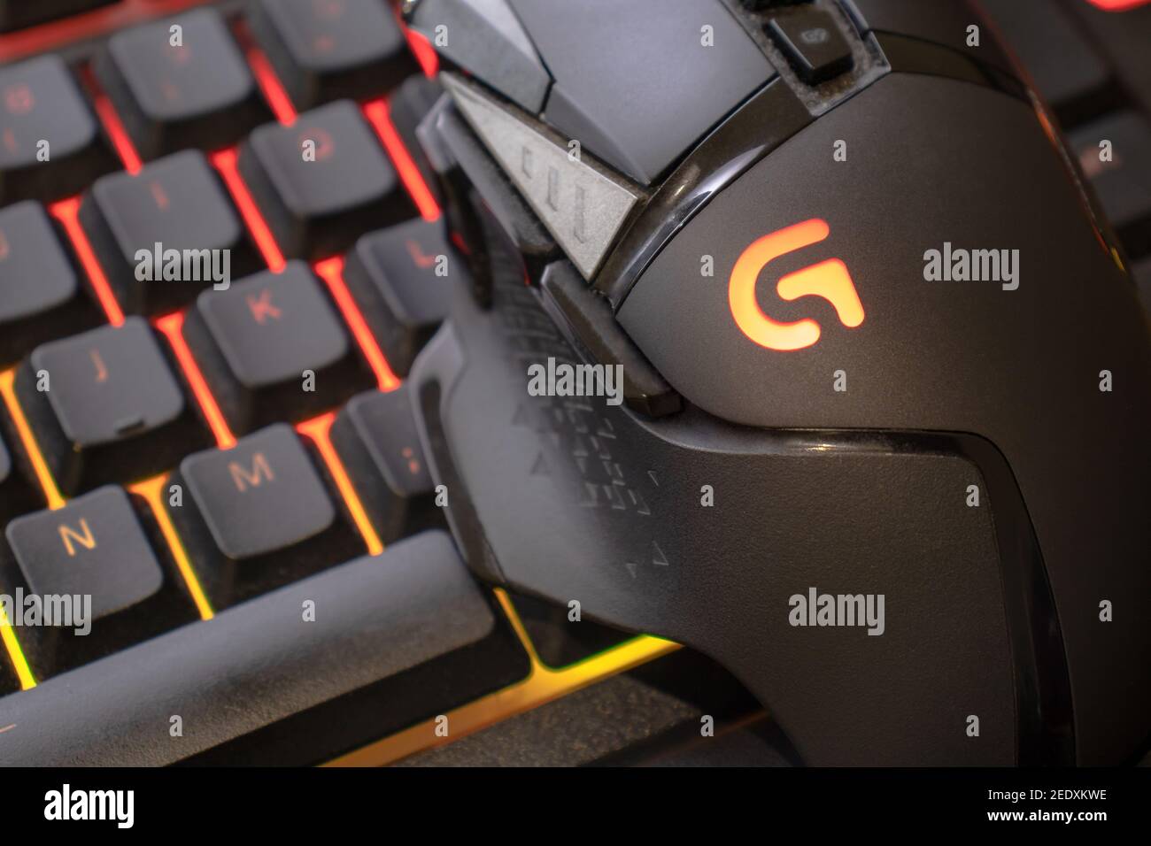 Logitech g502 hero gaming mouse on red illuminated gaming keyboard, close  up shot. devices to play on pc. Verona, 08-02-21 Stock Photo - Alamy