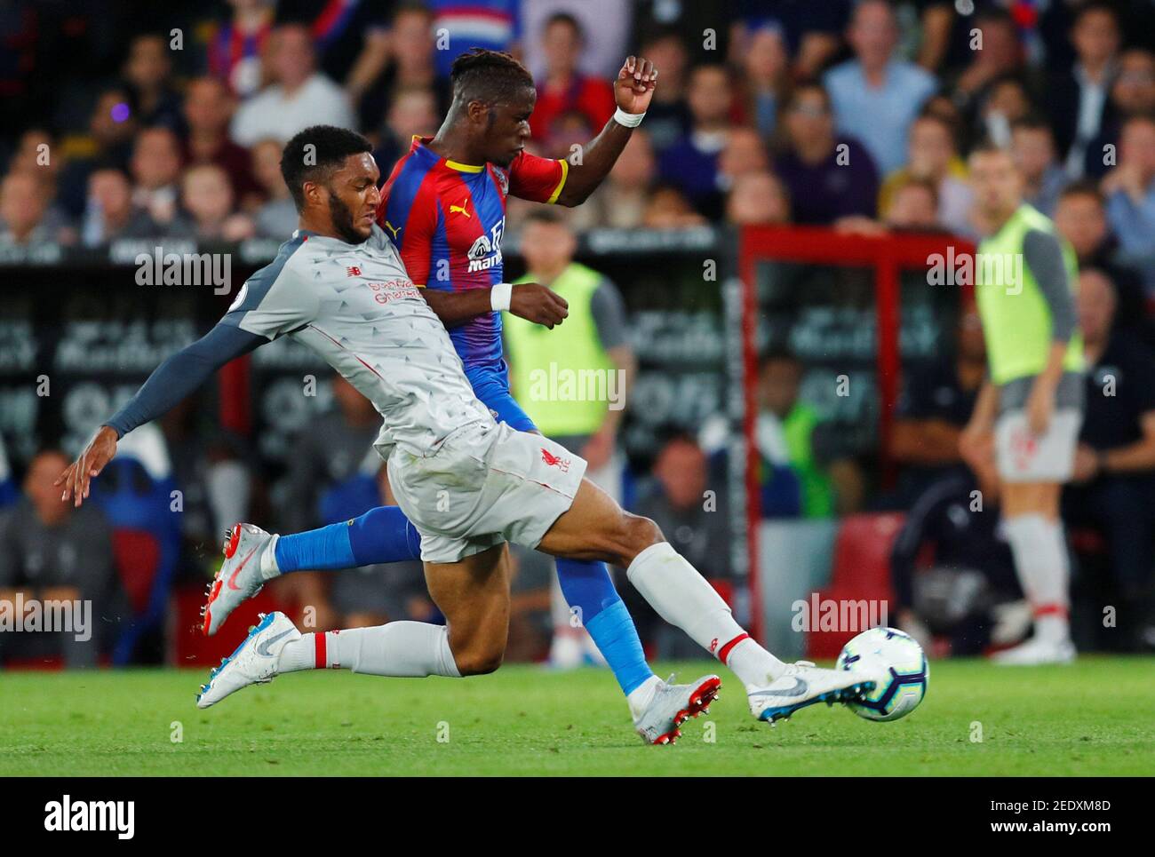 Soccer Football - Premier League - Crystal Palace v Liverpool - Selhurst Park, London, Britain - August 20, 2018  Crystal Palace's Wilfried Zaha in action with Liverpool's Joe Gomez               REUTERS/Eddie Keogh  EDITORIAL USE ONLY. No use with unauthorized audio, video, data, fixture lists, club/league logos or 'live' services. Online in-match use limited to 75 images, no video emulation. No use in betting, games or single club/league/player publications.  Please contact your account representative for further details. Stock Photo