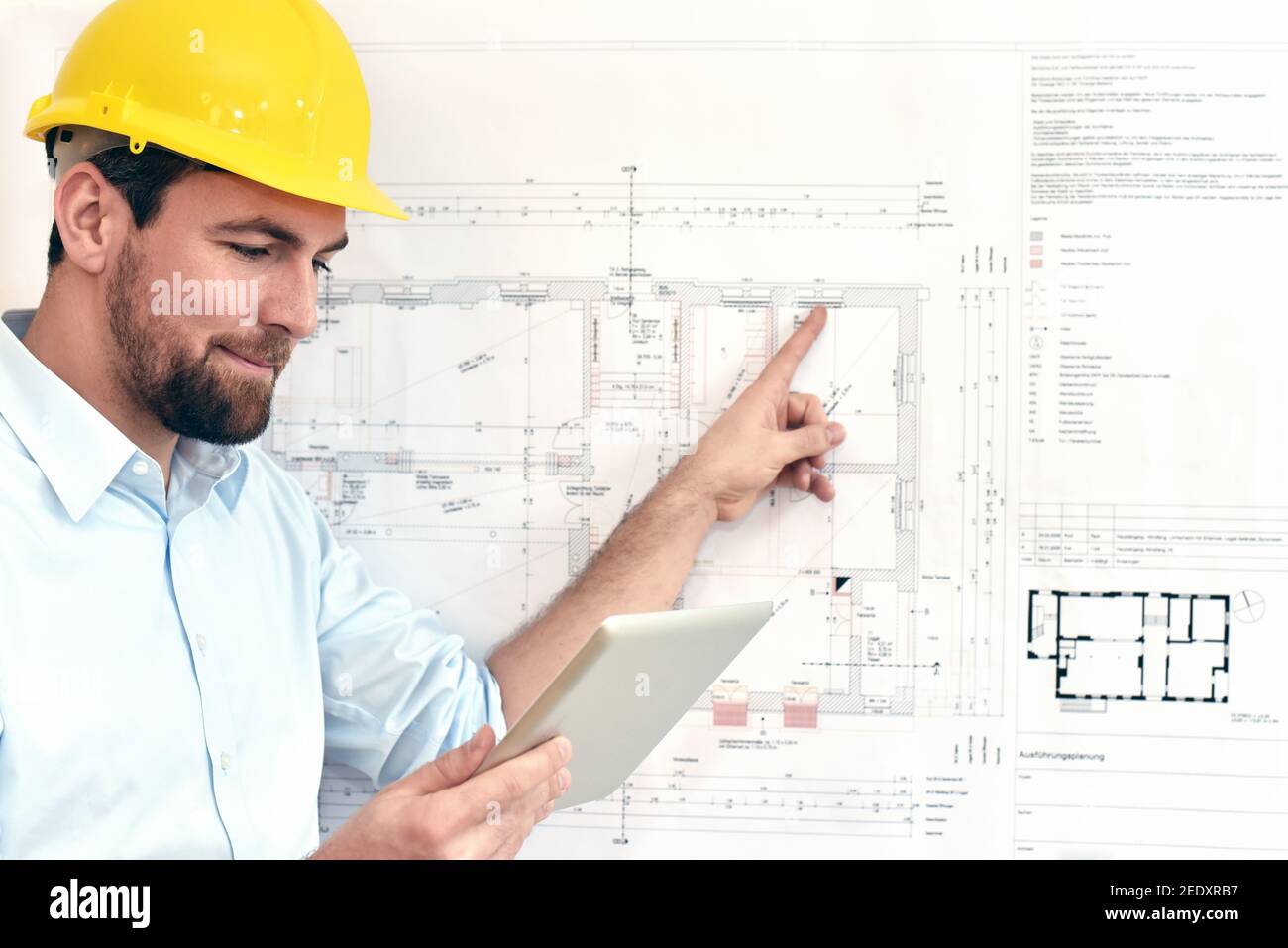 ArchitectPlanning Construction of a house on the Boaerd with the technical drawing - floor plan Stock Photo