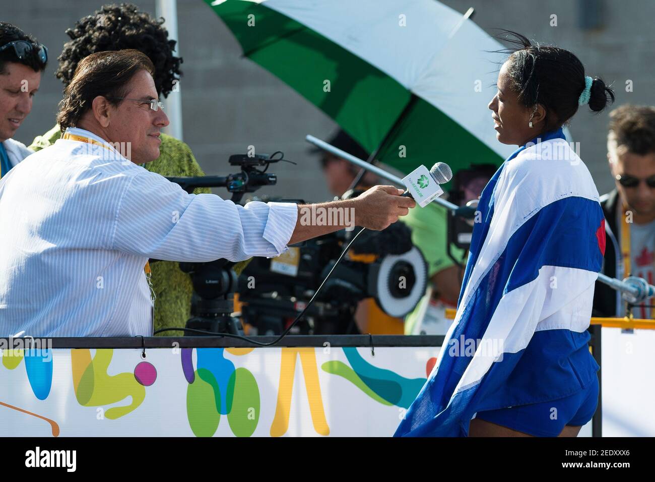 Aurelio Prieto interviews Omara Duran (right) from Cuba who wins two Gold Medals during day two of Parapan Am Games Athletics in Toronto. She wins in Stock Photo