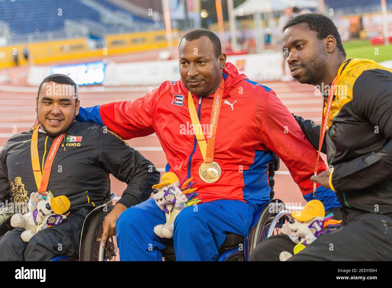 Leonardo Diaz from Cuba wins the gold medal in the Men's Discus Throw F54/55/56 Final during the Toronto Parapan Am Games. Tanto Cambell (right) from Stock Photo