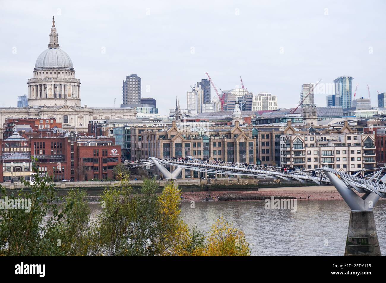 St. Paul's cathedral, View from Tate Modern, Millennium Bridge Footbridge, River Thames in London Stock Photo