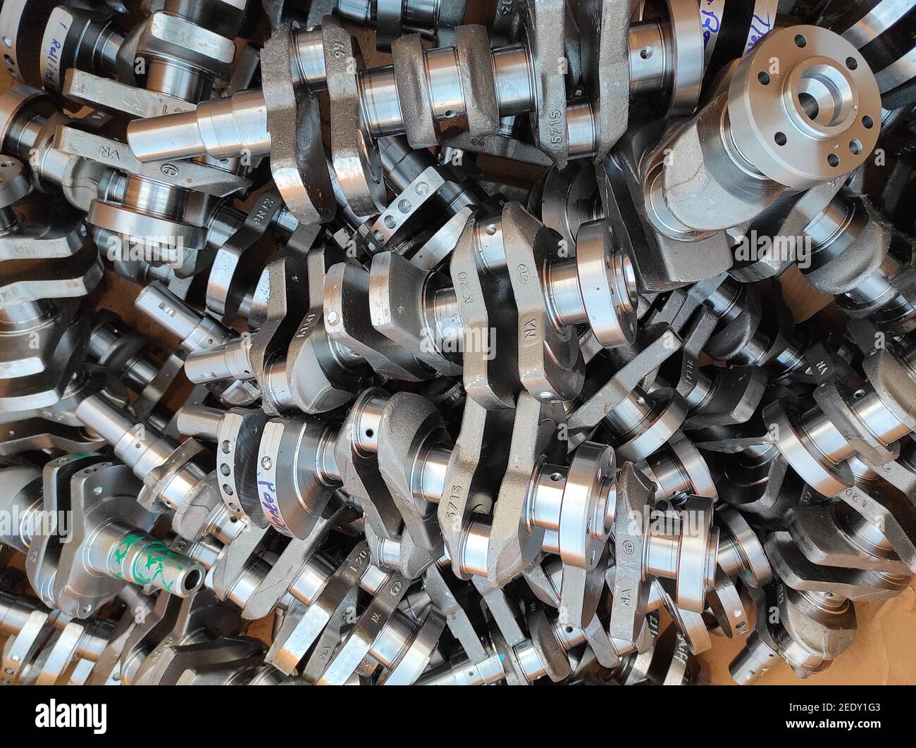 Closeup of a lot of engine crankshafts in a box Stock Photo