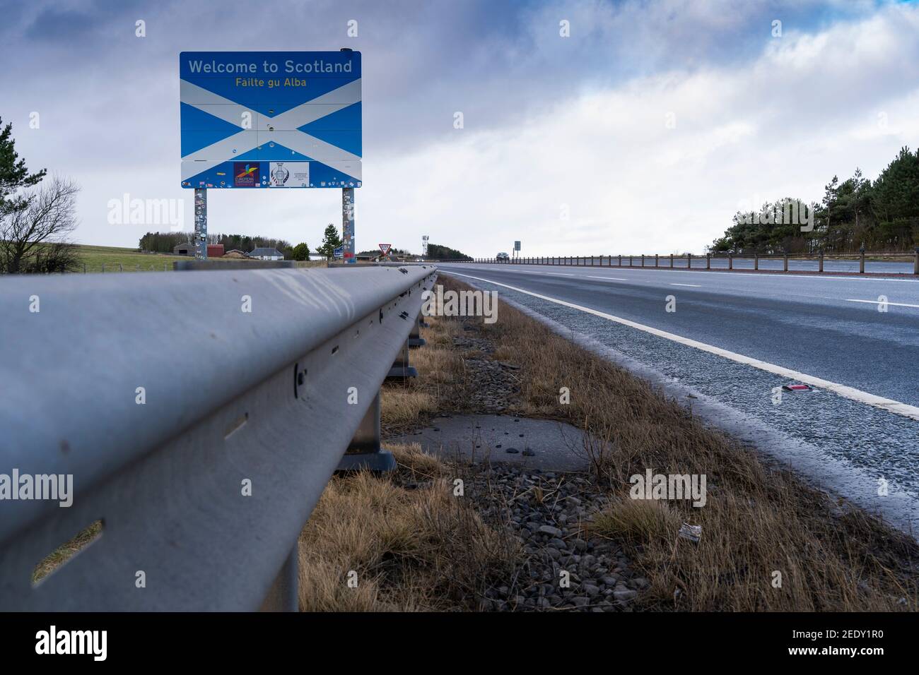 Lamberton, Scotland, UK. 15 Feb 2021. View of Scottish border on A1 just north of Berwick-upon-Tweed. Scotland’s First Minister Nicola Sturgeon has threatened to close the border between Scotland and England because English quarantine rules which come into force today are less strict than those in Scotland.  Iain Masterton/Alamy Live News Stock Photo