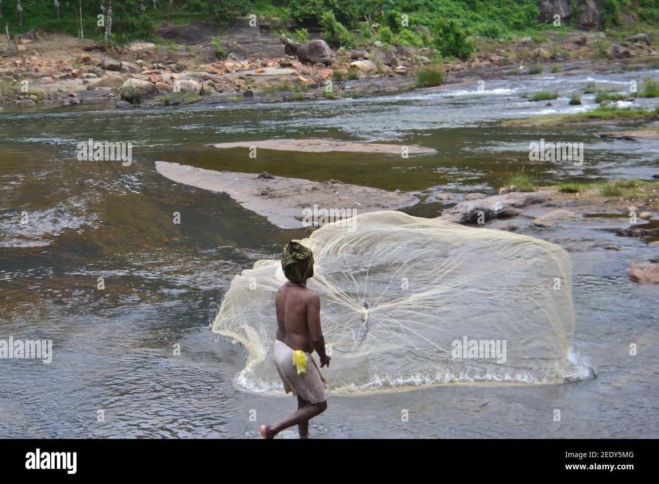 fisherman try to catch fish Stock Photo