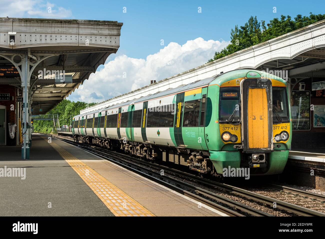 Class 377 passenger train in Southern livery at Purley railway station, England. Stock Photo