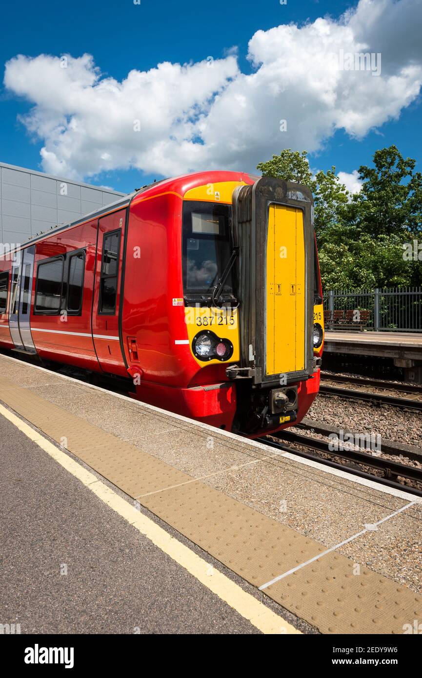 British rail class 387 passenger train in Gatwick Express livery waiting at a railway station platform, England. Stock Photo