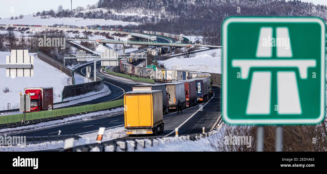 Petrovice, Czech Republic. 15th Feb, 2021. Trucks are jammed on the motorway D8 in front of the Czech-Germany border crossing in Petrovice, Czech Republic, February 15, 2021. The trucks are piling up due to border controls as part of efforts to curb the spread of the Coronavirus. Credit: Vojtech Hajek/CTK Photo/Alamy Live News Stock Photo