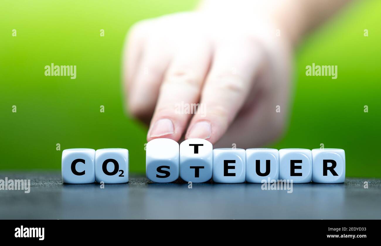 Dice form the German expressions 'CO2 Steuer' (CO2 Tax) and 'Teuer' (expensive). Stock Photo