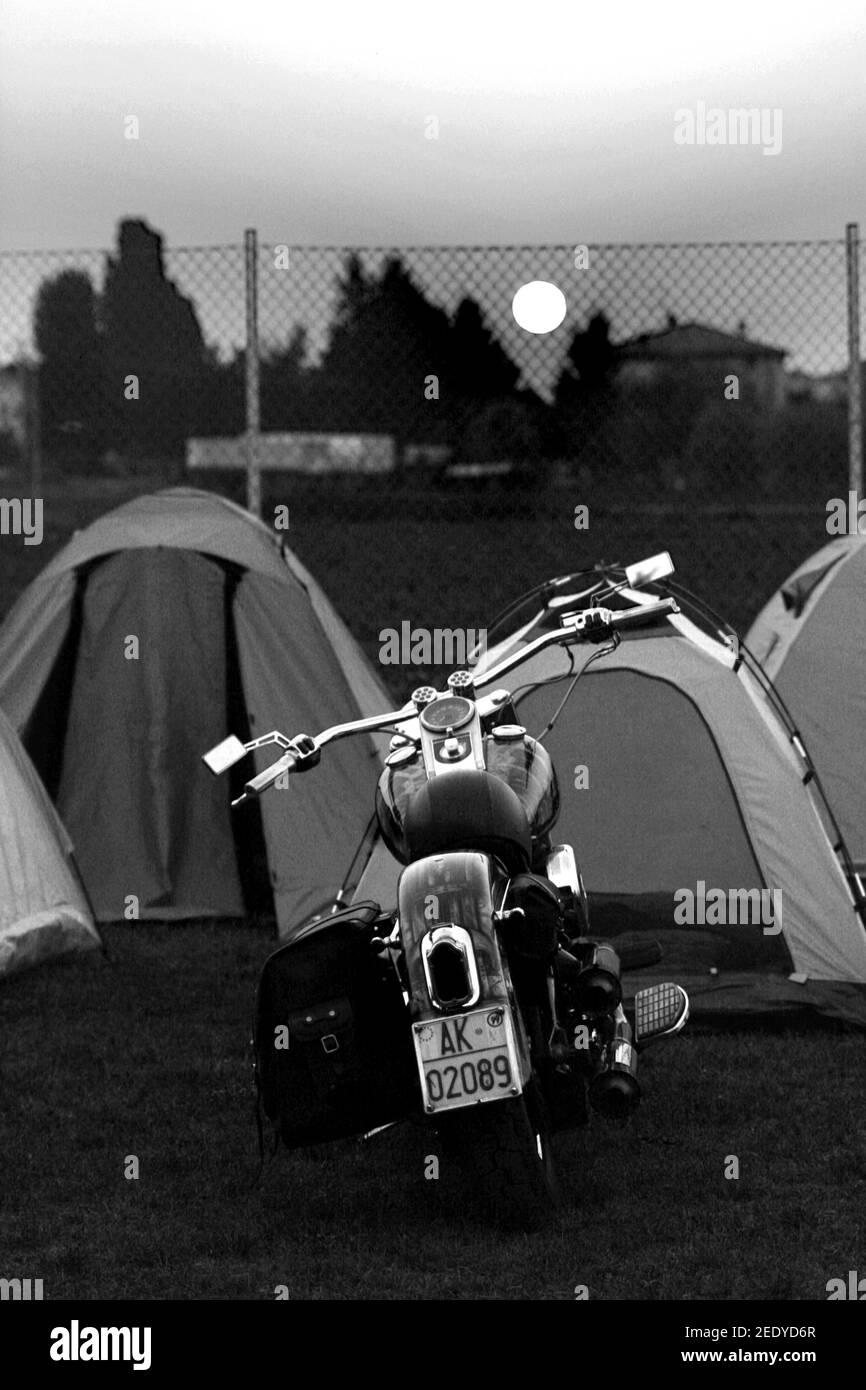 PARMA, ITALY - Sep 02, 2007: Black and Withe vertical photo of motorcycles in front of the tents Stock Photo