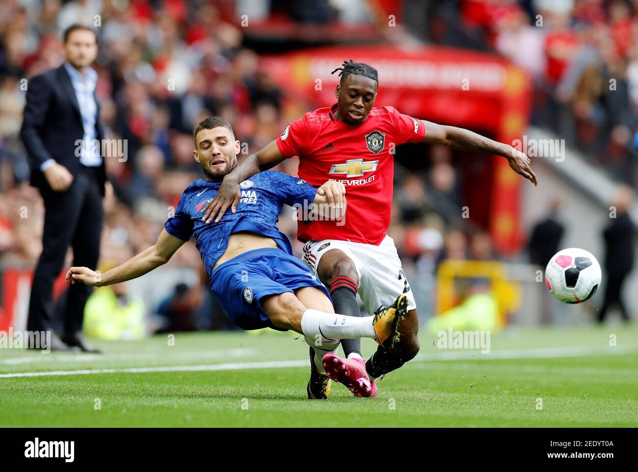 Soccer Football - Premier League - Manchester United v Chelsea - Old Trafford, Manchester, Britain - August 11, 2019  Manchester United's Aaron Wan-Bissaka in action with Chelsea's Mateo Kovacic   REUTERS/Phil Noble  EDITORIAL USE ONLY. No use with unauthorized audio, video, data, fixture lists, club/league logos or 'live' services. Online in-match use limited to 75 images, no video emulation. No use in betting, games or single club/league/player publications.  Please contact your account representative for further details. Stock Photo