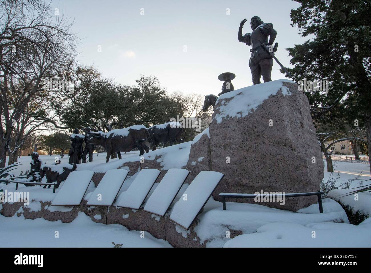 Austin, Texas USA Feb 15, 2021: The Texas Capitol grounds including the Tejano Monument are covered in 6-7 inches of rare snowfall Monday morning after an overnight winter storm blew into central Texas. Most offices and schools are closed until warmer weather arrives later in the week. Credit: Bob Daemmrich/Alamy Live News Stock Photo