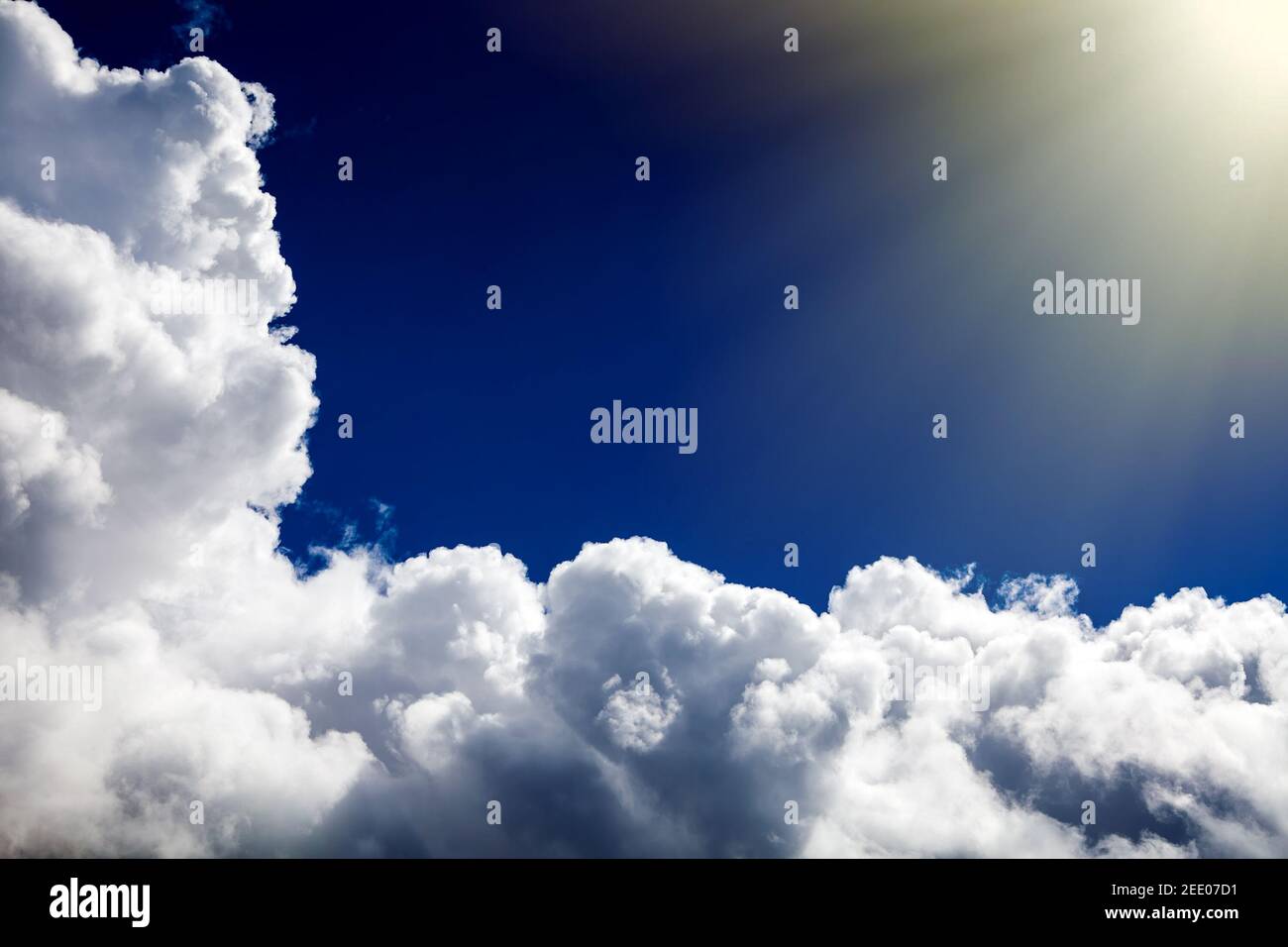 Cloudscape Background with Sun and Blue Sky Stock Photo - Alamy
