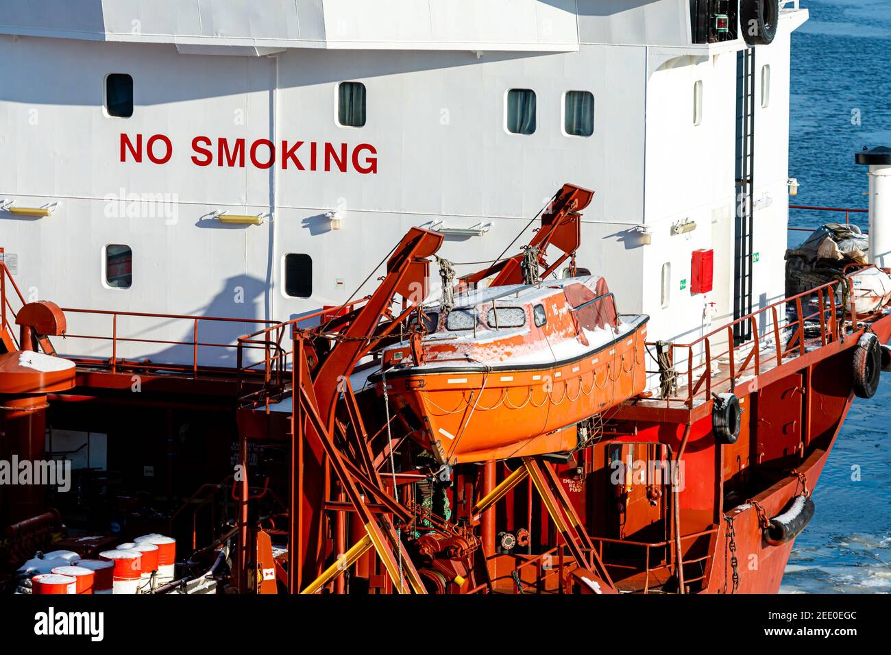 cargo vessel emergency safety rescue boat on deck Stock Photo