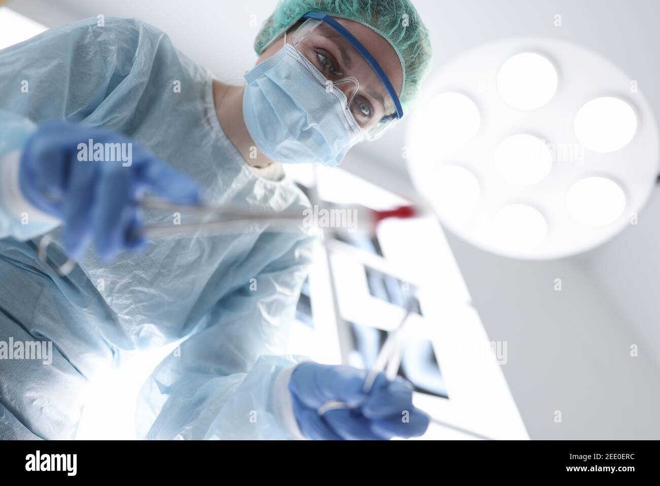 Surgeon female doctor in operating room portrait. Stock Photo