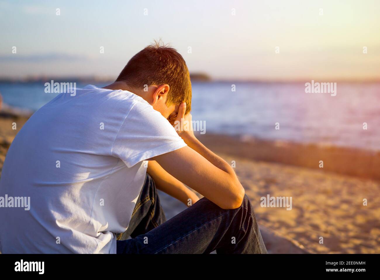 Sad and Lonely Young Man sit