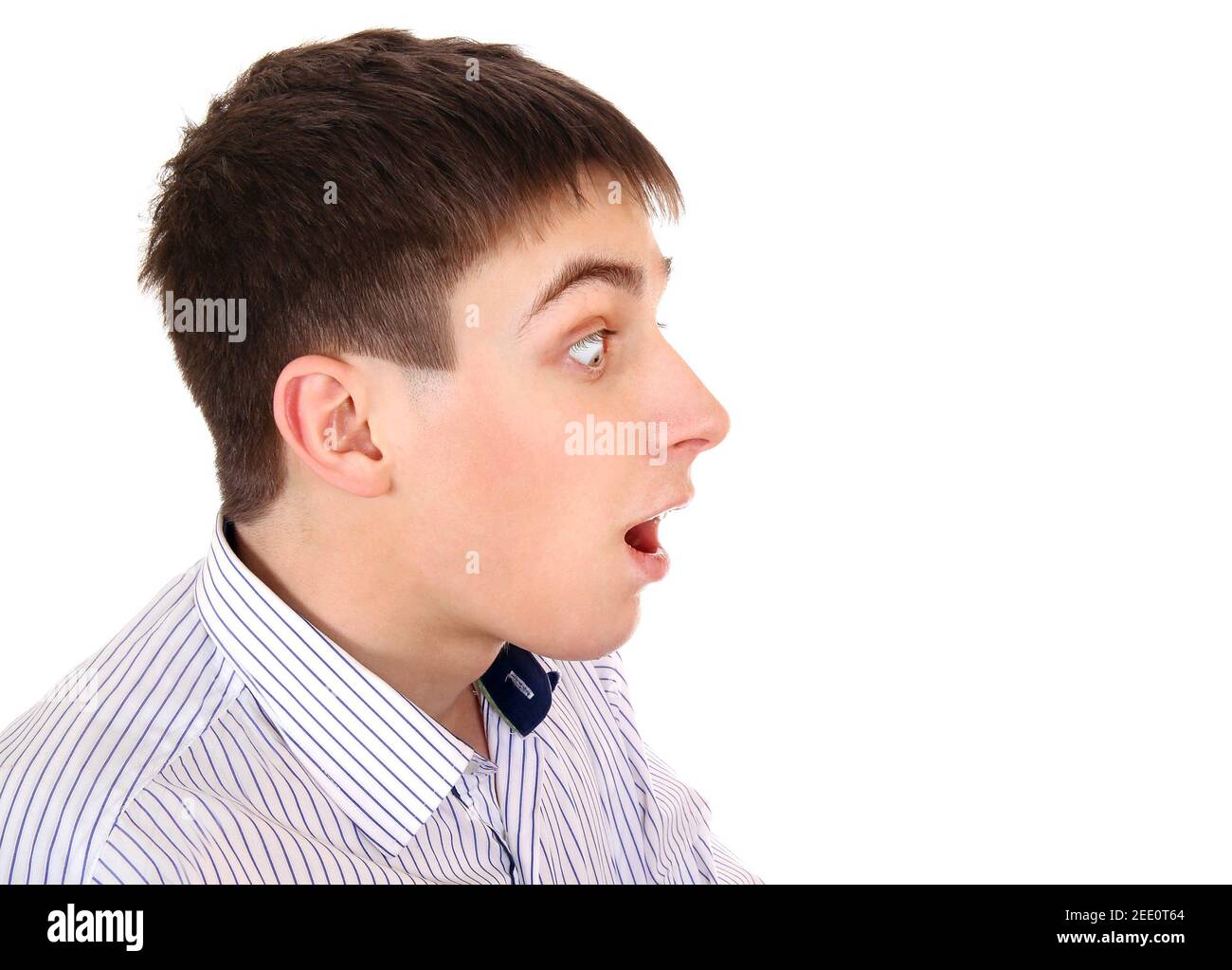 Side View of a Surprised Young Man on the White Background closeup Stock Photo
