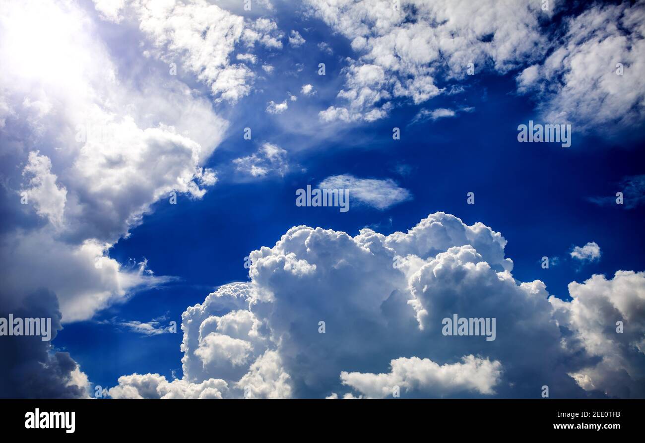 Cloudscape Background with Sun and Blue Sky Stock Photo - Alamy