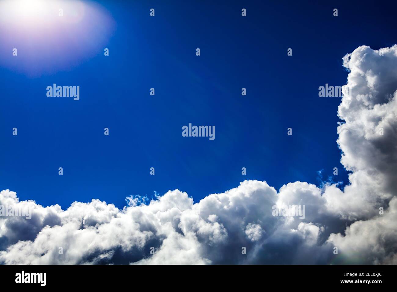 Cloudscape Background with Sun and Blue Sky Stock Photo - Alamy