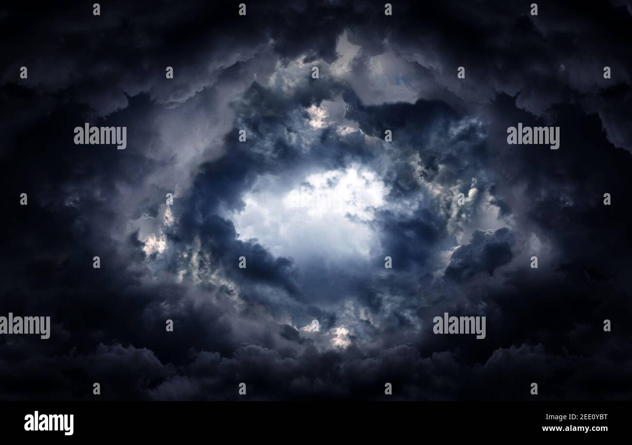 Hole in the Dark and Dramatic Storm Clouds Stock Photo