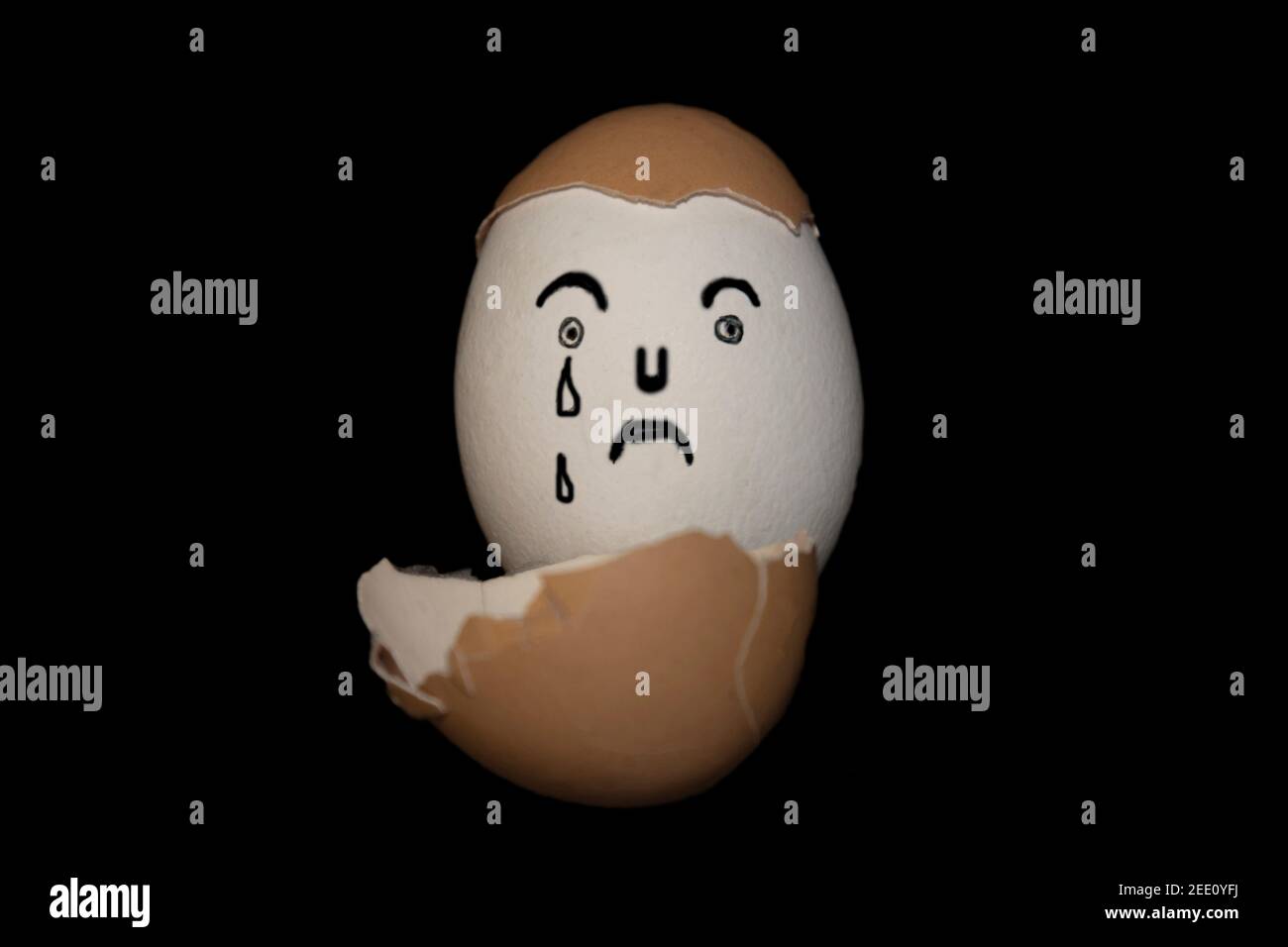 Painted sad face on an egg Stock Photo
