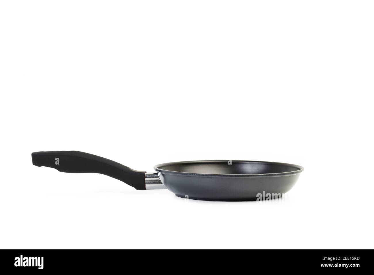 A black frying pan on a white background with copy space Stock Photo