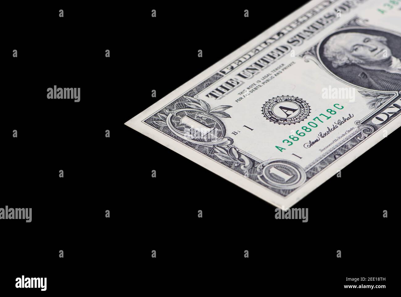 one dollar banknote is lying on a black background with copy space Stock Photo