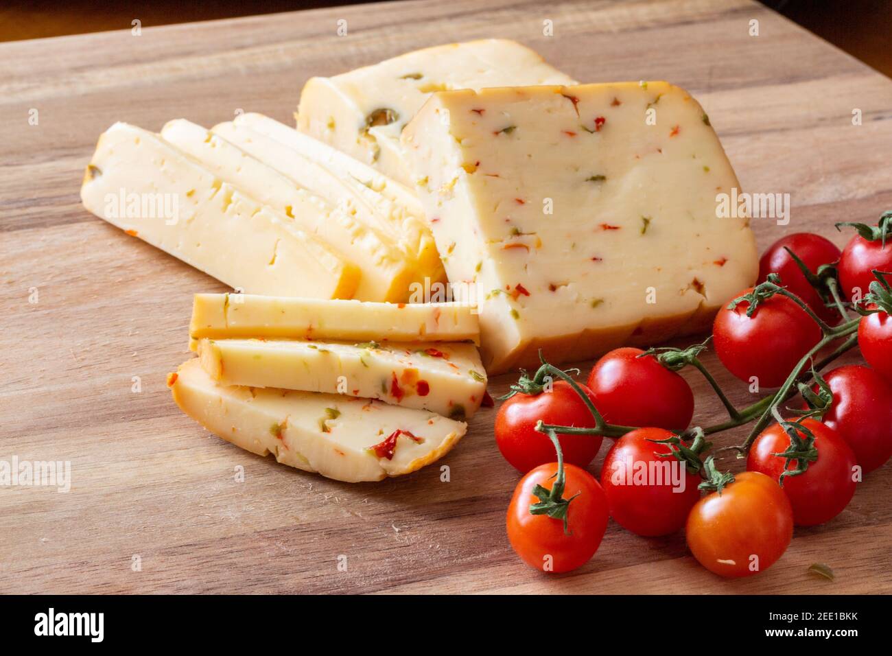 Soft cheese with olives and cheese with chili peppers with tomatoes and