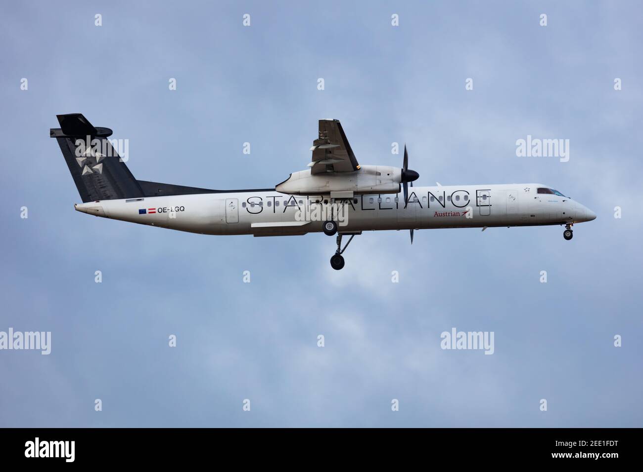 Star Alliance Austrian Airlines Bombardier DHC-8 Q400 OE-LGQ passenger plane arrival and landing at Vienna International Airport Stock Photo