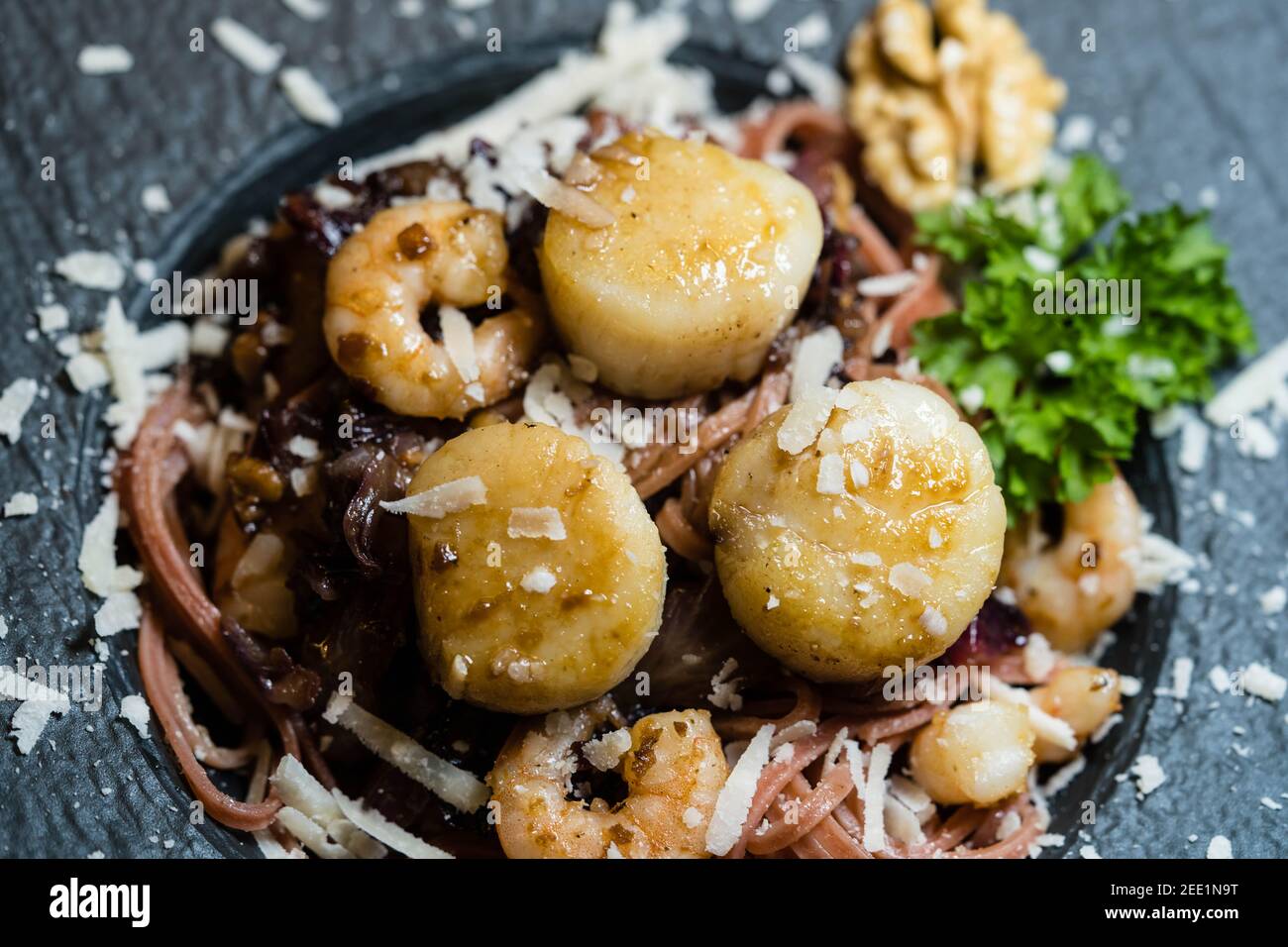 scallops with red linguine pasta herbs and spices Stock Photo Alamy